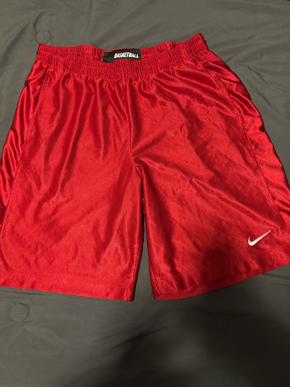Nike Men's Red Athletic Mesh Shorts with White Swoosh